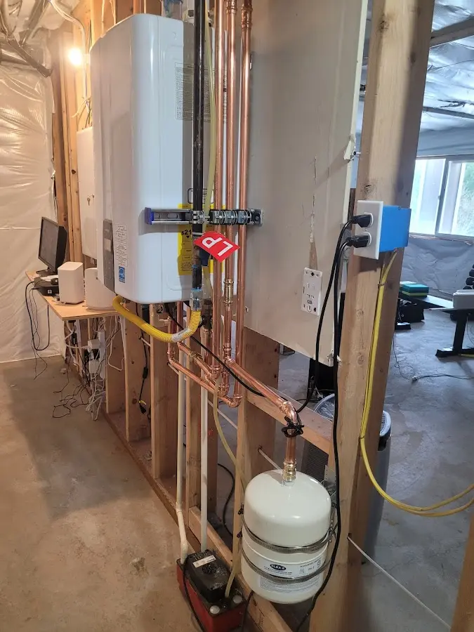 Licensed plumber repairing a kitchen sink in Corry